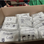 Plast scouts in New York City add artistic finishing touches to each Pocket First Aid Kit